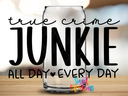 True Crime Junkie design close-up on a clear glass can tumbler