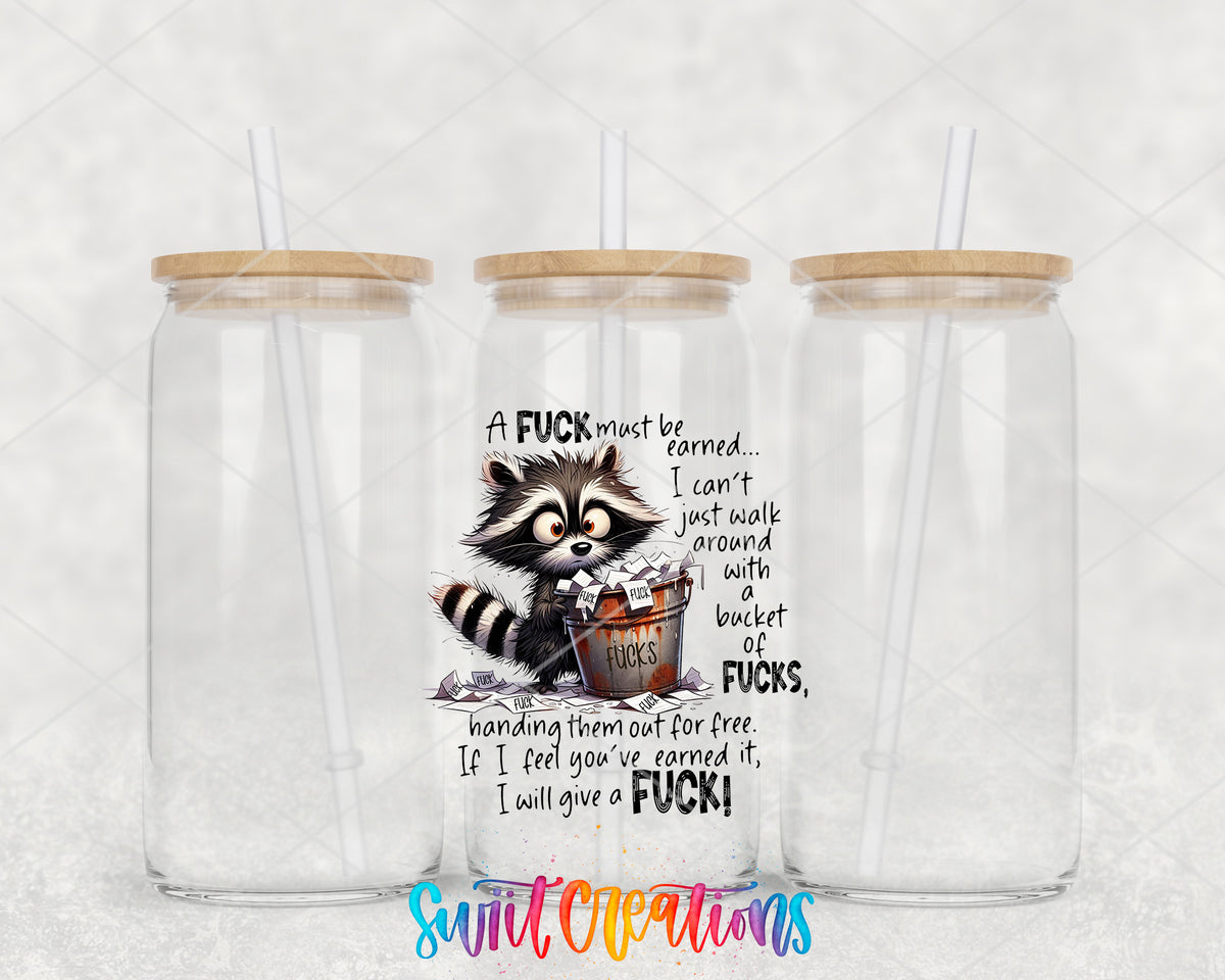 A Fuck Must Be Earned clear glass tumbler group mockup with bamboo lids and straws