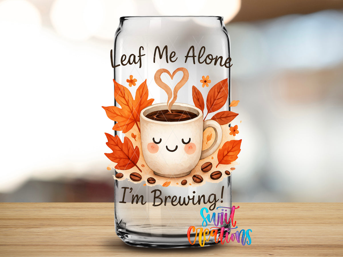 Leaf Me Alone design close-up on a clear glass can tumbler