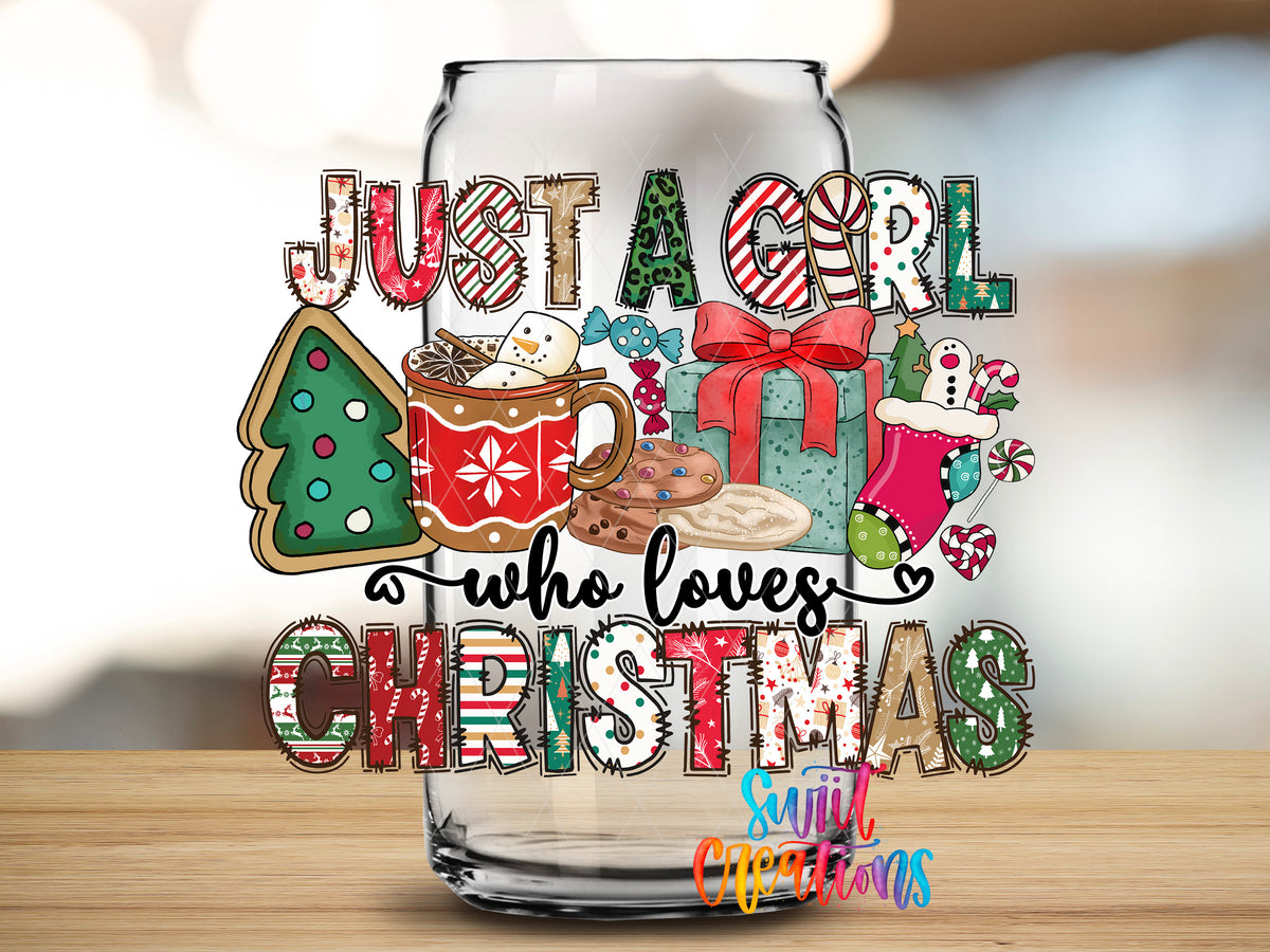 Just a Girl Who Loves Christmas design close-up on a clear glass can tumbler