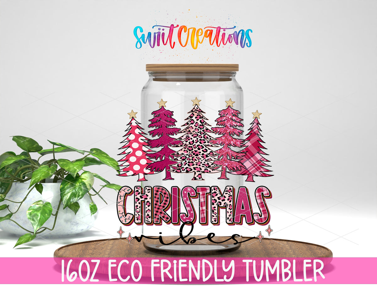 Christmas Vibes design on a 16 oz clear glass tumbler with bamboo lid