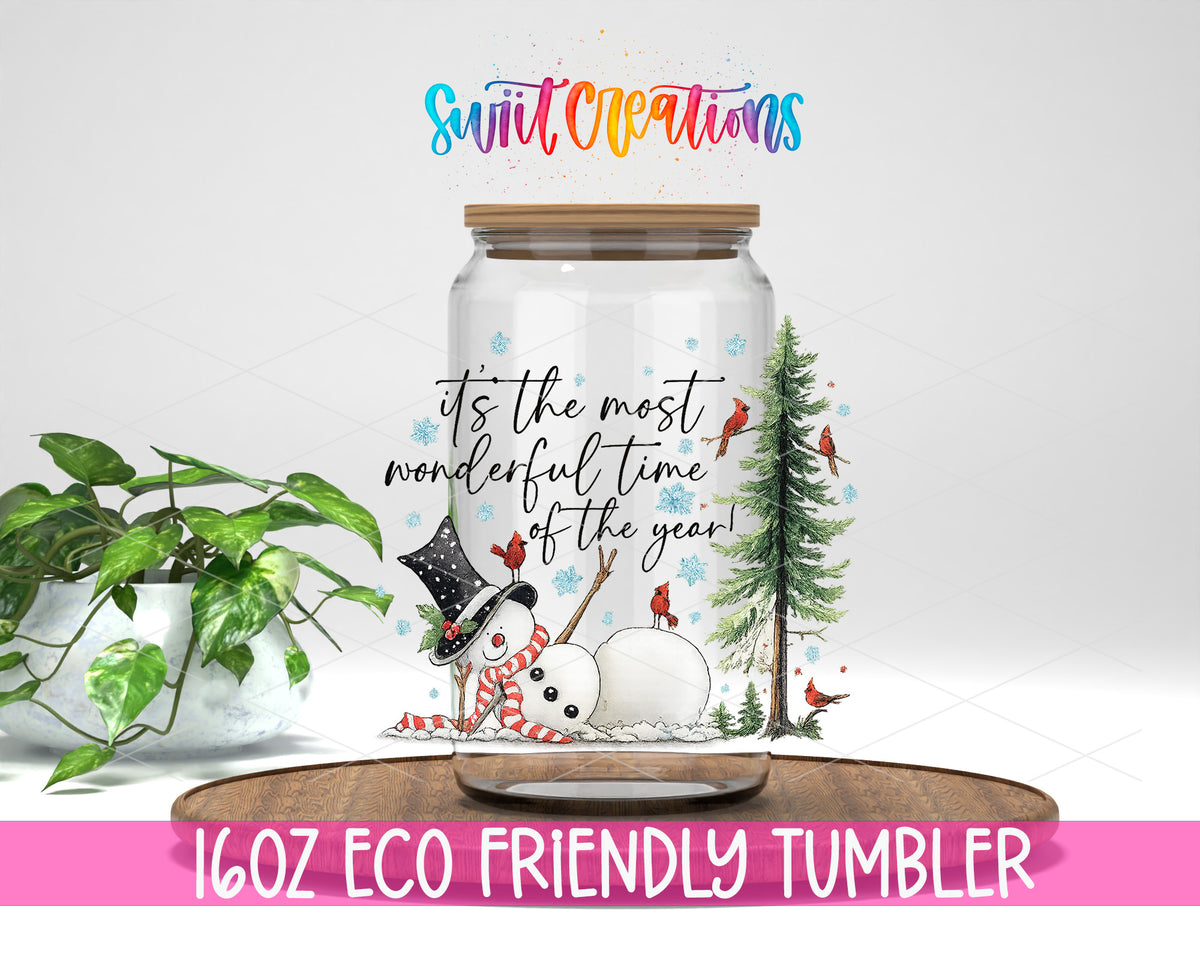 It's the Most Wonderful Time of the Year design on a 16 oz clear glass tumbler with bamboo lid