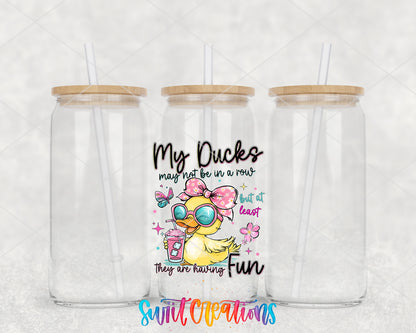 My Ducks May Not Be in a Row clear glass tumbler group mockup with bamboo lids and straws