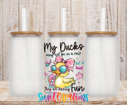 My Ducks May Not Be in a Row frosted glass tumbler mockup with bamboo lids and straws
