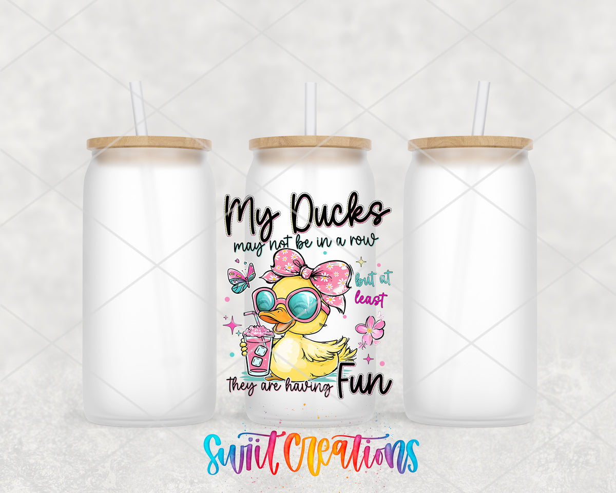 My Ducks May Not Be in a Row frosted glass tumbler group view with lids and straws