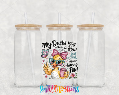 My Ducks May Not Be in a Row clear glass tumbler group mockup with bamboo lids and straws