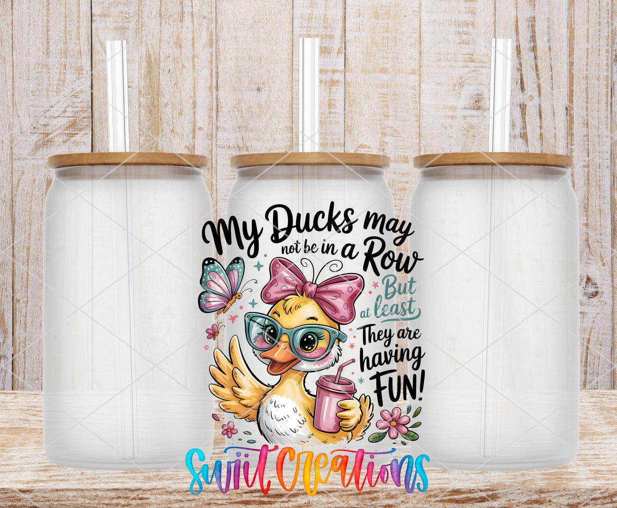 My Ducks May Not Be in a Row frosted glass tumbler mockup with bamboo lids and straws