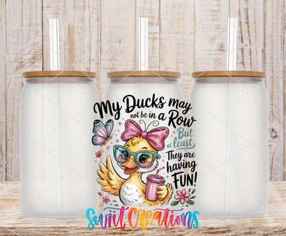 My Ducks May Not Be in a Row frosted glass tumbler mockup with bamboo lids and straws