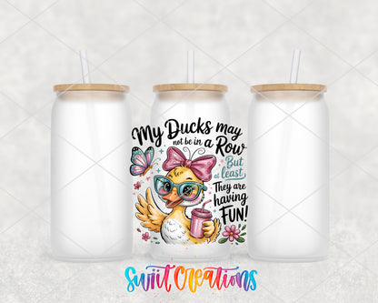 My Ducks May Not Be in a Row frosted glass tumbler group view with lids and straws