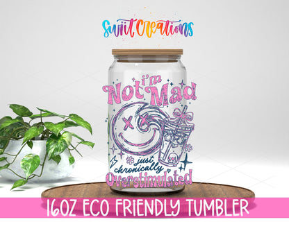 I'm Not Mad Just Overstimulated design on a 16 oz clear glass tumbler with bamboo lid