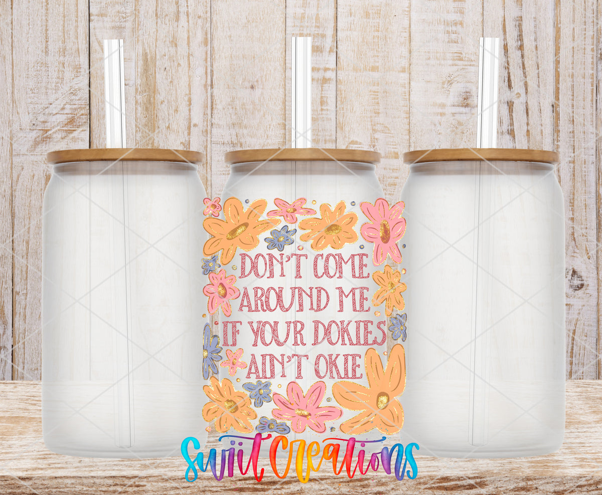 Dookies Ain't Okie frosted glass tumbler mockup with bamboo lids and straws