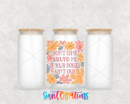 Dookies Ain't Okie frosted glass tumbler group view with lids and straws