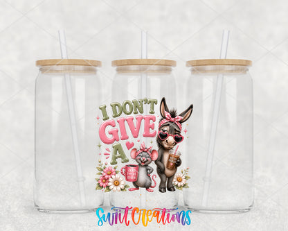 I Don't Give a Rat's Ass clear glass tumbler group mockup with bamboo lids and straws