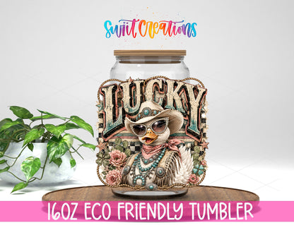 Western Glam Lucky Duck design on a 16 oz clear glass tumbler with bamboo lid