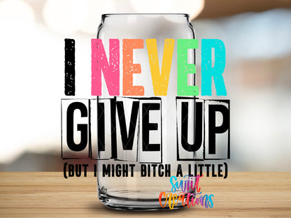 I Never Give Up design close-up on a clear glass can tumbler