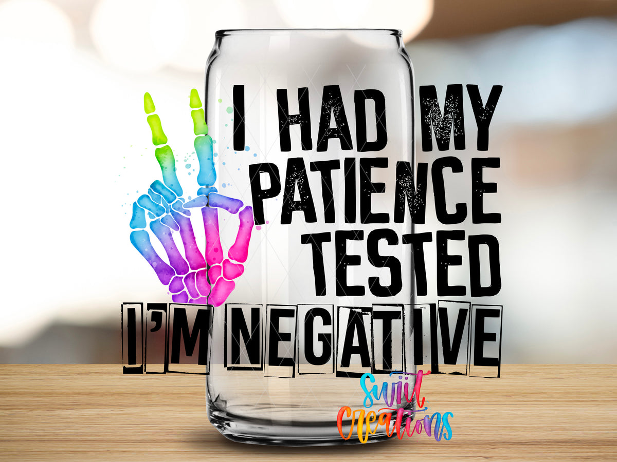 Patience Tested I Am Negative design close-up on a clear glass can tumbler
