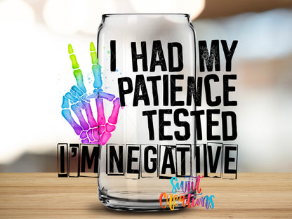 Patience Tested I Am Negative design close-up on a clear glass can tumbler