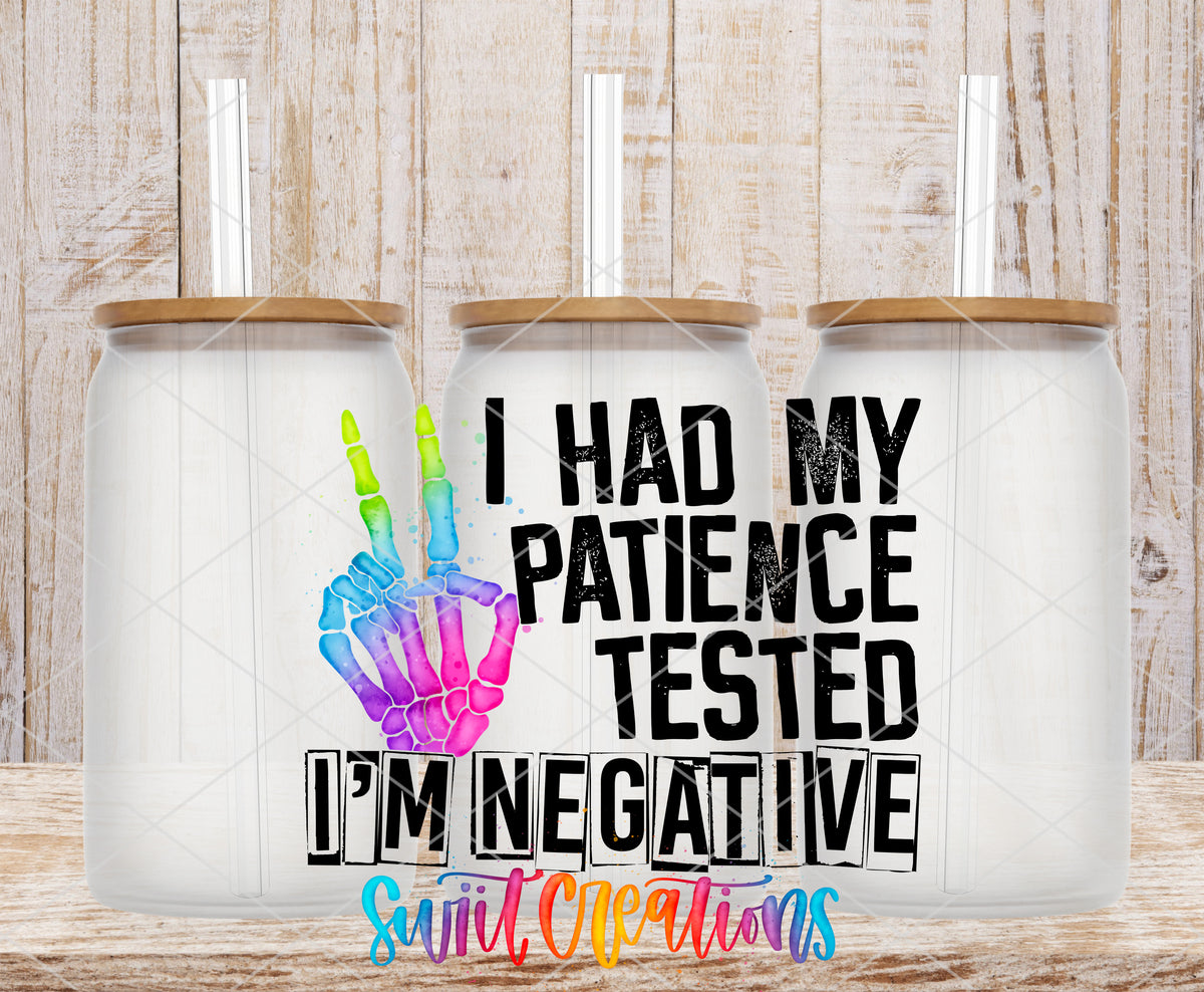 Patience Tested I Am Negative frosted glass tumbler mockup with bamboo lids and straws