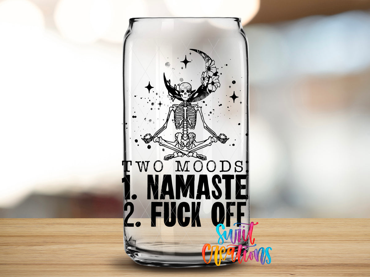 Two Moods Namaste design close-up on a clear glass can tumbler