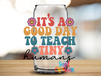 Good Day to Teach Tiny Humans design close-up on a clear glass can tumbler