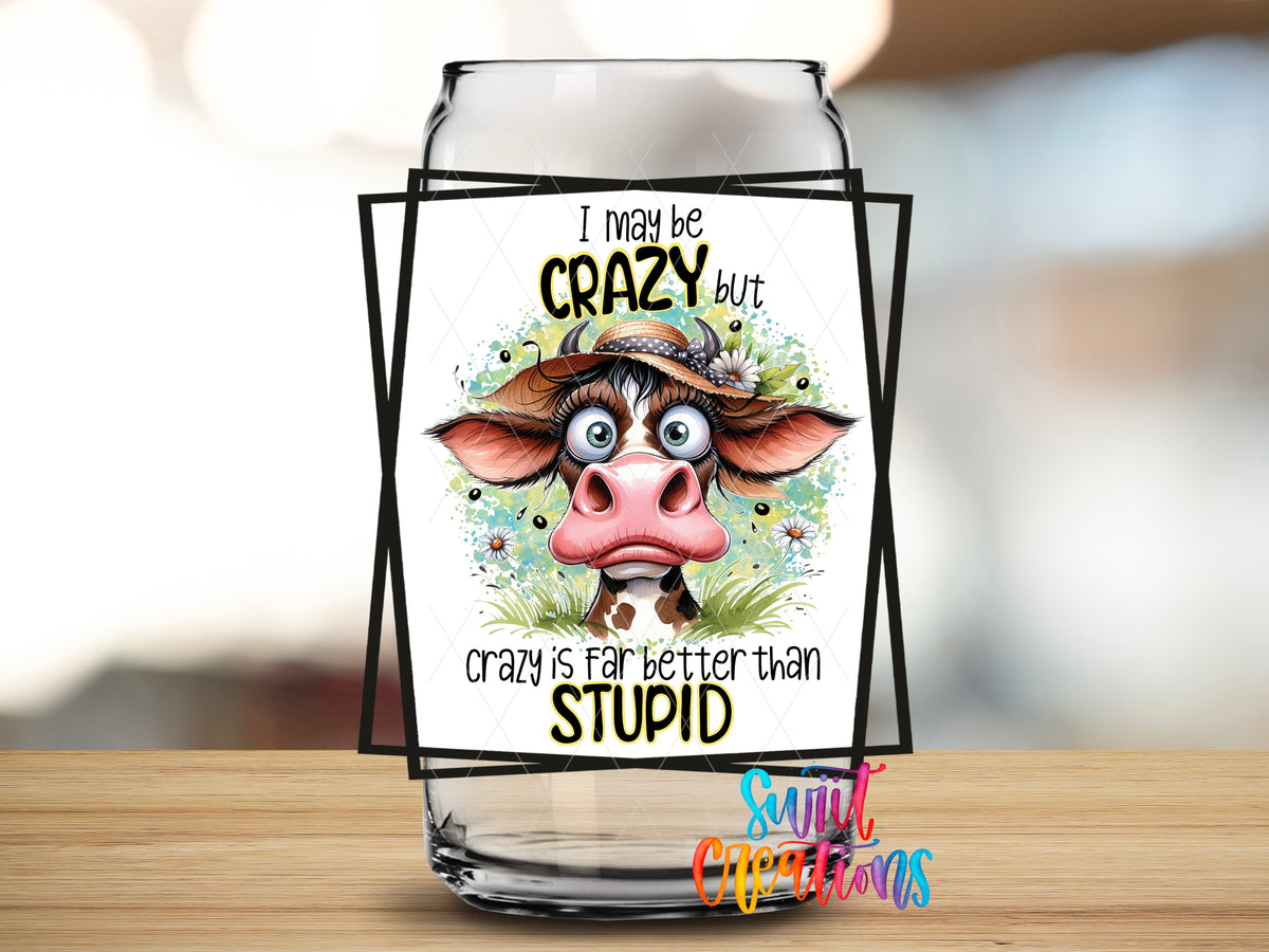 I May Be Crazy Cow design close-up on a clear glass can tumbler