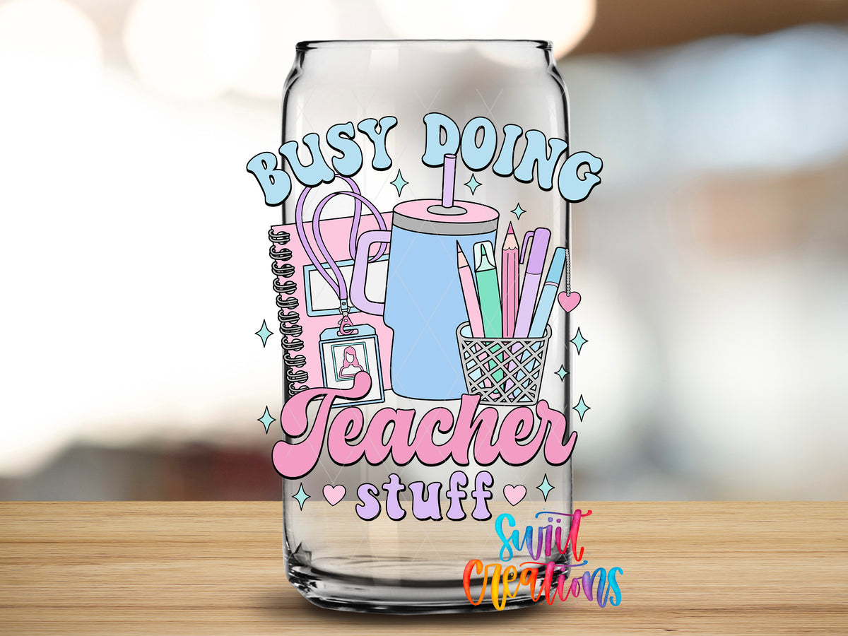Busy Doing Teacher Stuff design close-up on a clear glass can tumbler