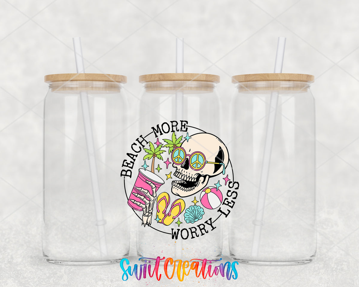 Beach More Worry Less Skull clear glass tumbler group mockup with bamboo lids and straws