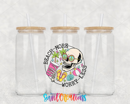 Beach More Worry Less Skull clear glass tumbler group mockup with bamboo lids and straws