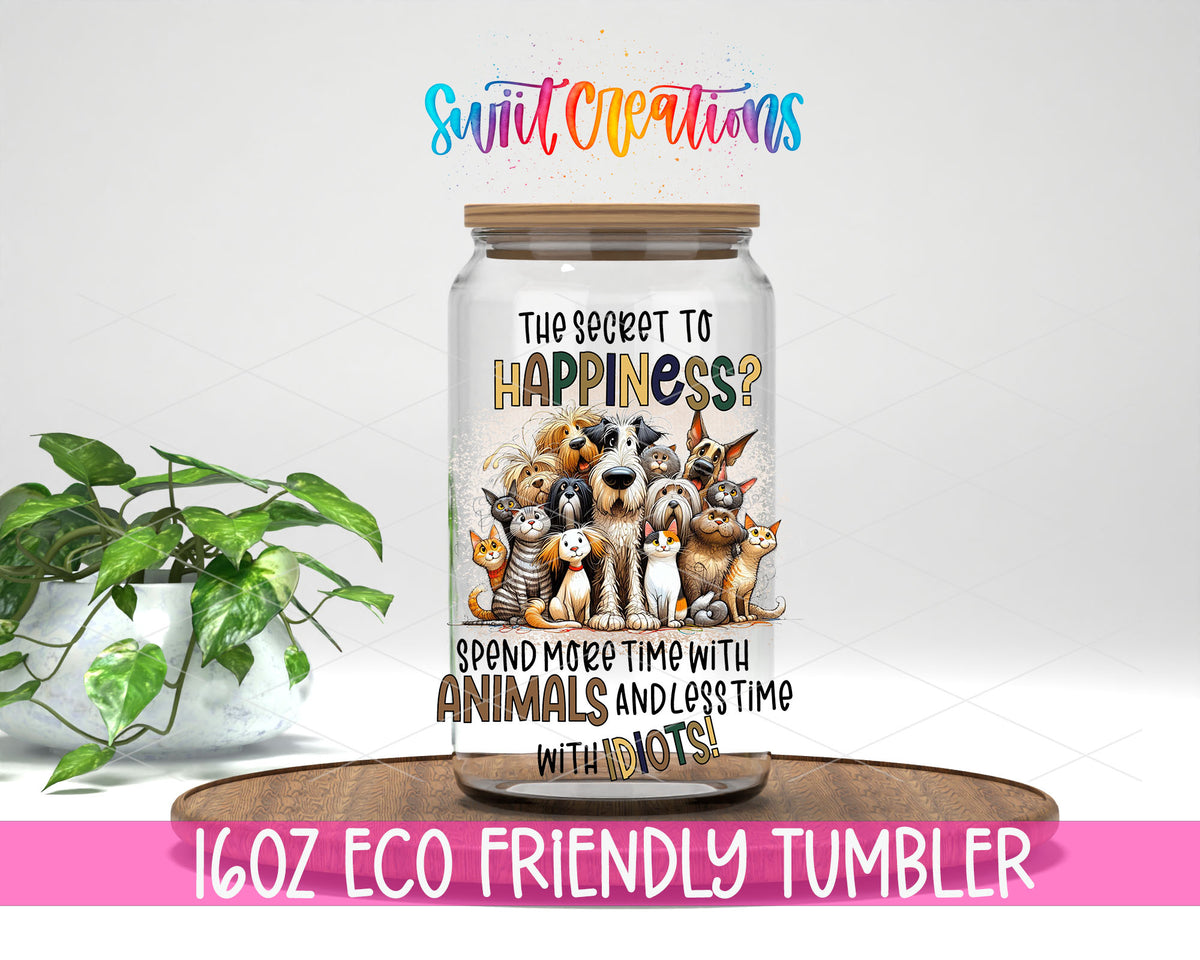 The Secret to Happiness Animals design on a 16 oz clear glass tumbler with bamboo lid