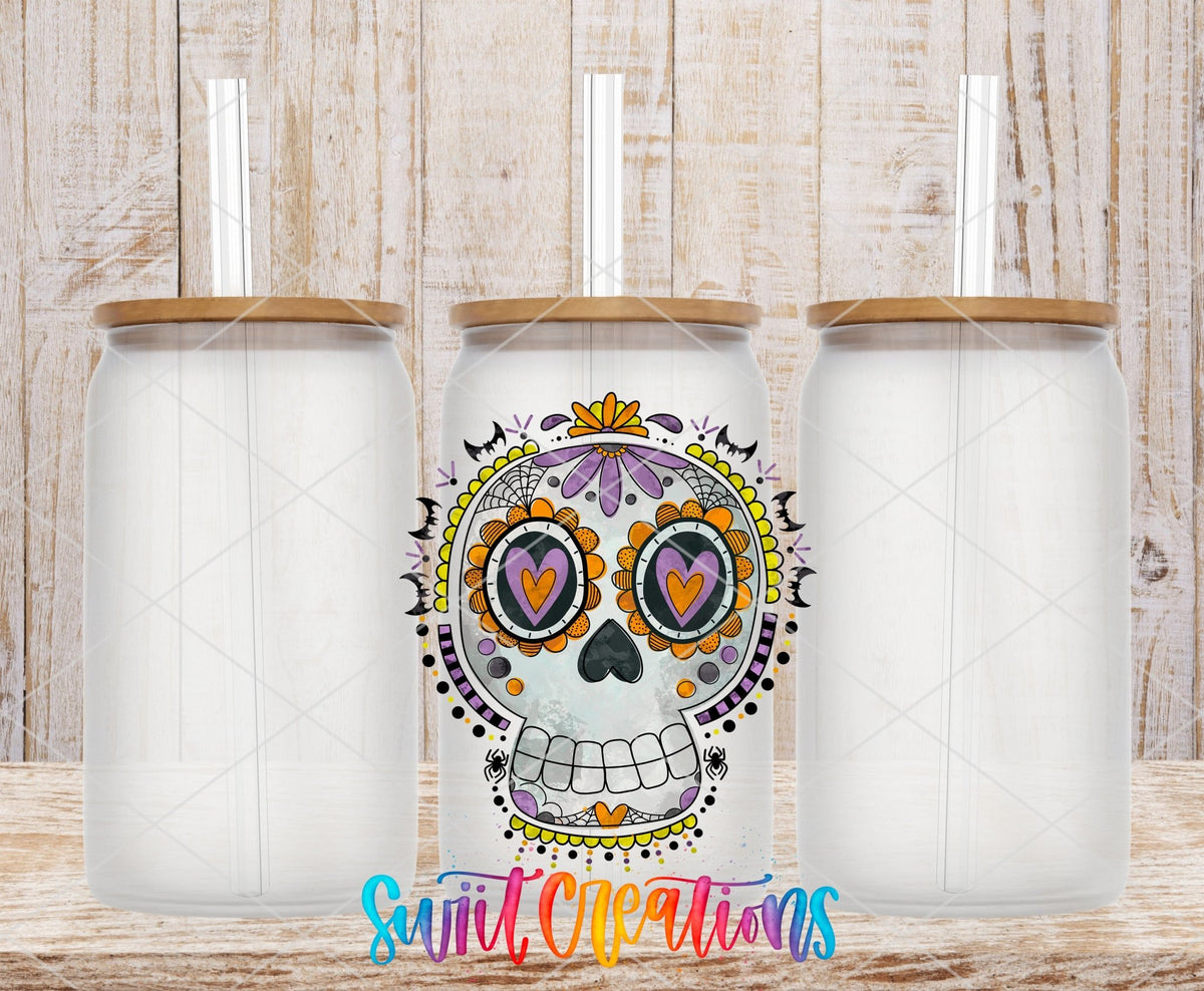 Halloween Sugar Skull Spooky Floral UV DTF transfer applied to a clear glass can set from Swiit Creations