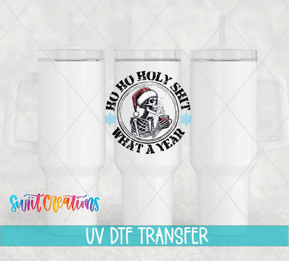 Swiit Creations UV DTF Holy Shit What a Year Christmas transfer shown on a white tumbler set