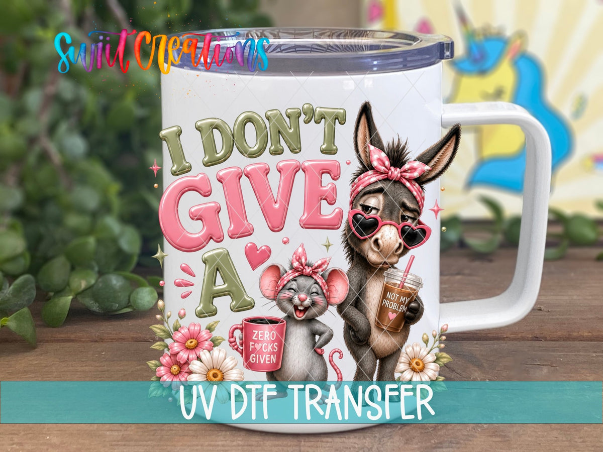 I Don't Give A Rat's Ass Donkey Mouse UV DTF transfer displayed on a white coffee mug from Swiit Creations
