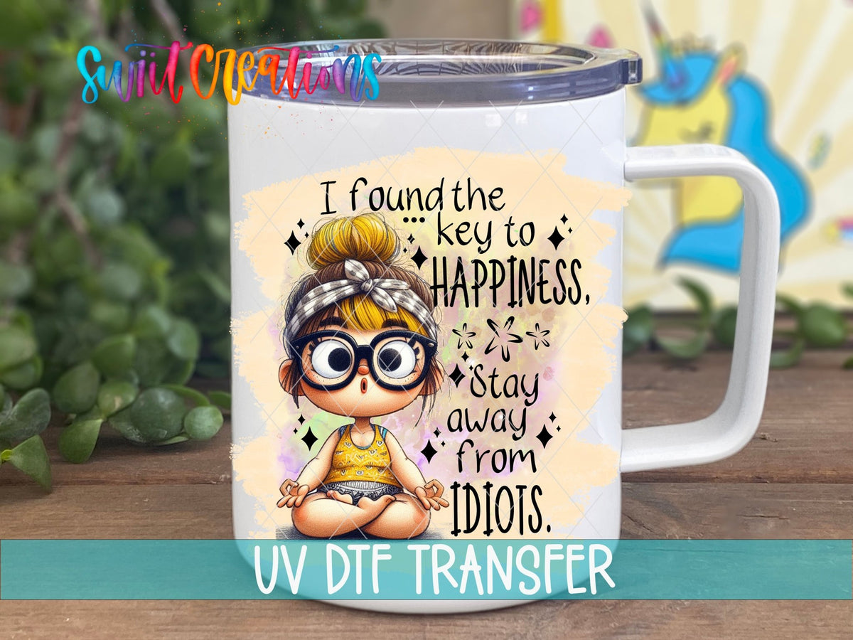 Swiit Creations UV DTF I Found the Secret to Happiness transfer displayed on a white coffee mug