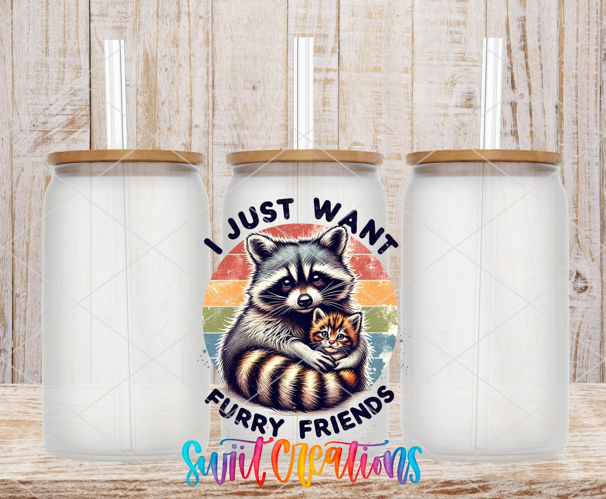 I Just Want Furry Friends UV DTF transfer applied to a clear glass can set from Swiit Creations