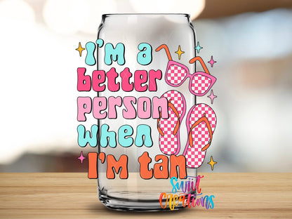 I’m a Better Person When I’m Tan UV DTF transfer applied to a clear glass can from Swiit Creations
