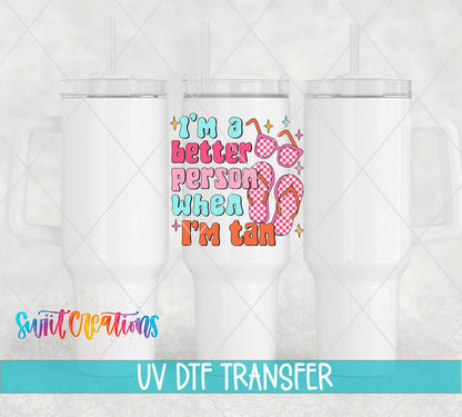 I’m a Better Person When I’m Tan UV DTF transfer applied to a white tumbler set from Swiit Creations
