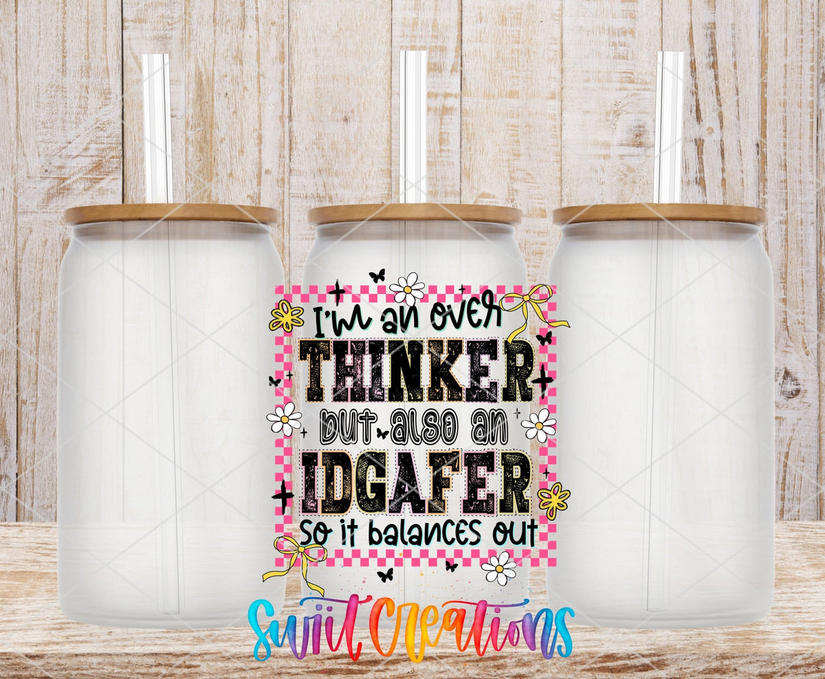 I’m An Over Thinker But Also An IDGAFer UV DTF transfer applied to a clear glass can set from Swiit Creations