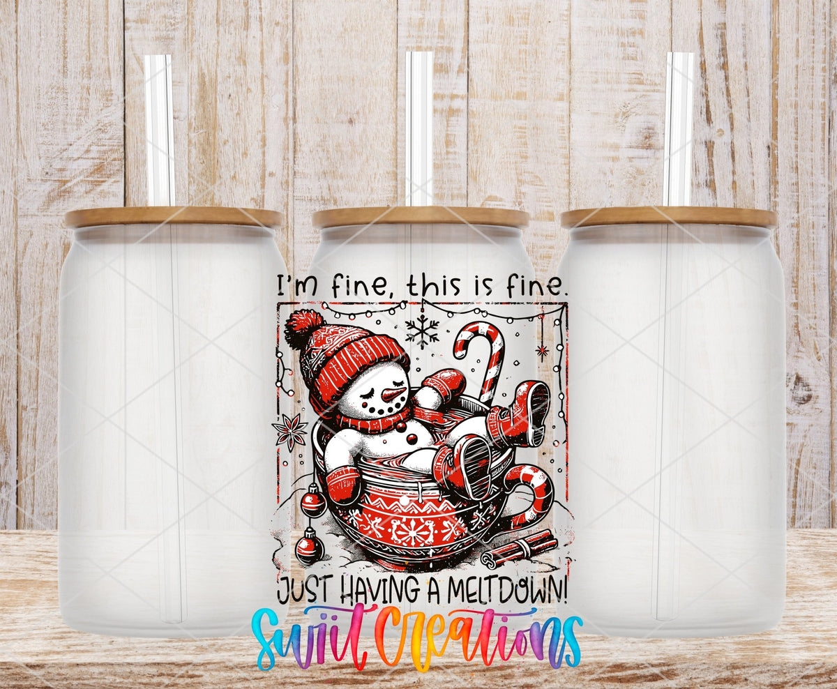 Swiit Creations UV DTF Snowman Having a Meltdown transfer shown on a clear glass can set