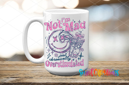 I’m Not Mad, Chronically Overstimulated UV DTF transfer displayed on a white ceramic mug from Swiit Creations
