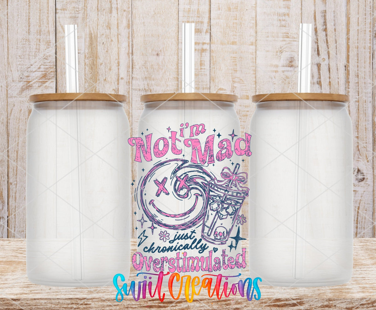 I’m Not Mad, Chronically Overstimulated UV DTF transfer applied to a clear glass can set from Swiit Creations
