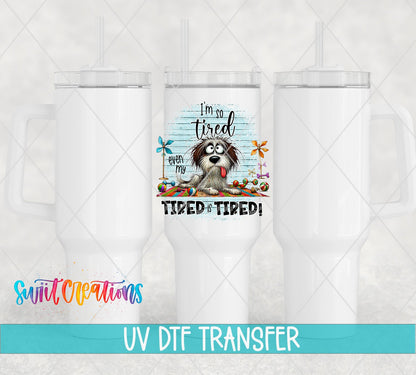 Swiit Creations UV DTF Even My Tired Is Tired transfer shown on a white tumbler set