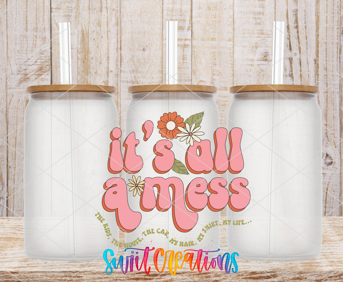 It’s All a Mess UV DTF transfer applied to a clear glass can set from Swiit Creations