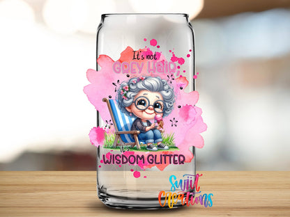 Swiit Creations UV DTF It's Not Grey Hair It's Wisdom Glitter transfer applied to a clear glass can