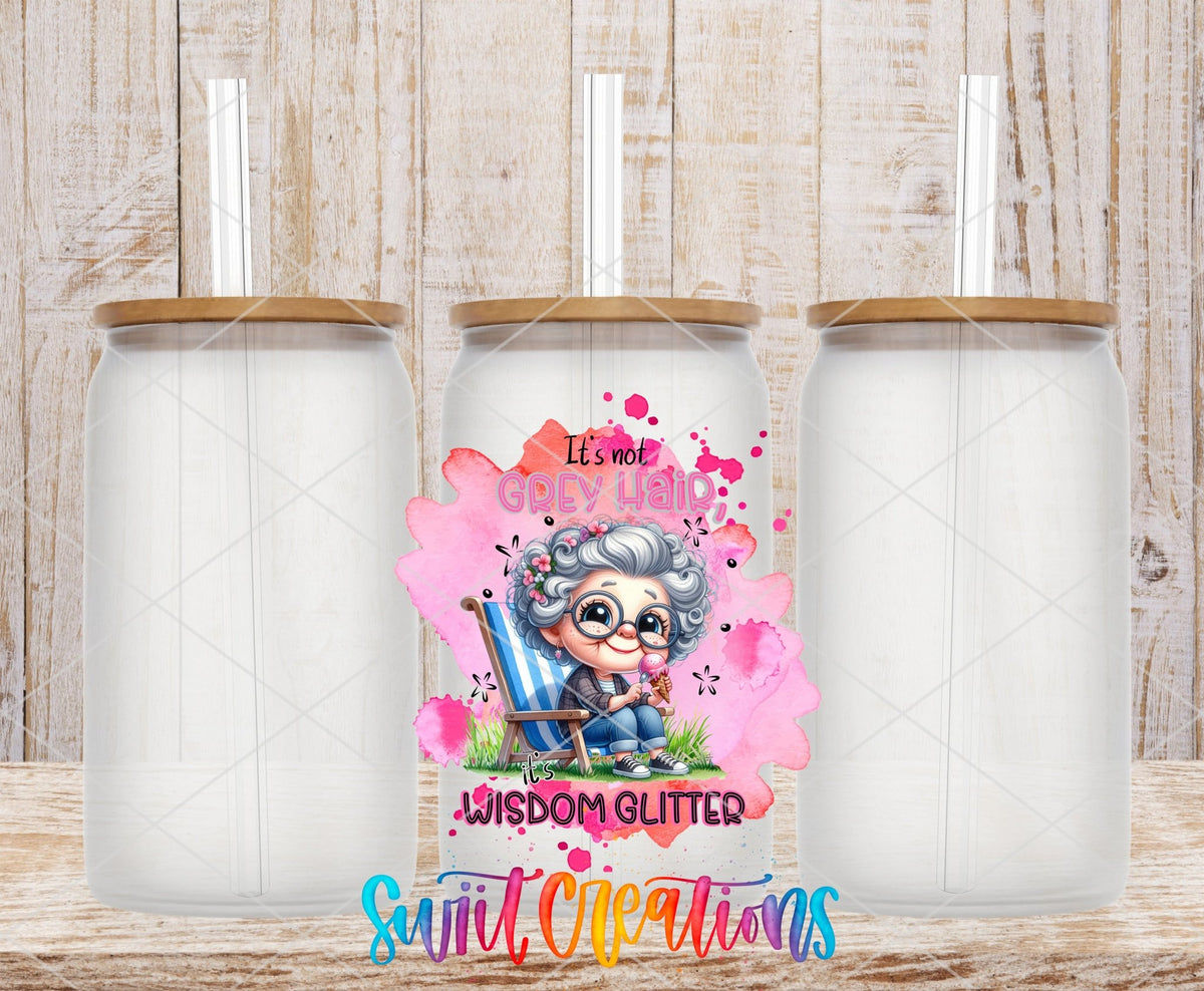 Swiit Creations UV DTF It's Not Grey Hair It's Wisdom Glitter transfer shown on a clear glass can set