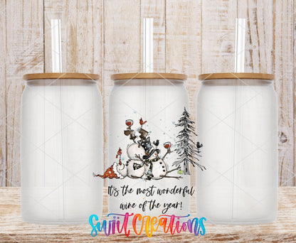 Swiit Creations UV DTF Wonderful Wine of the Year Snowman transfer shown on a clear glass can set