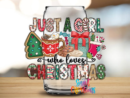 Just a Girl Who Loves Christmas UV DTF transfer applied to a clear glass can from Swiit Creations