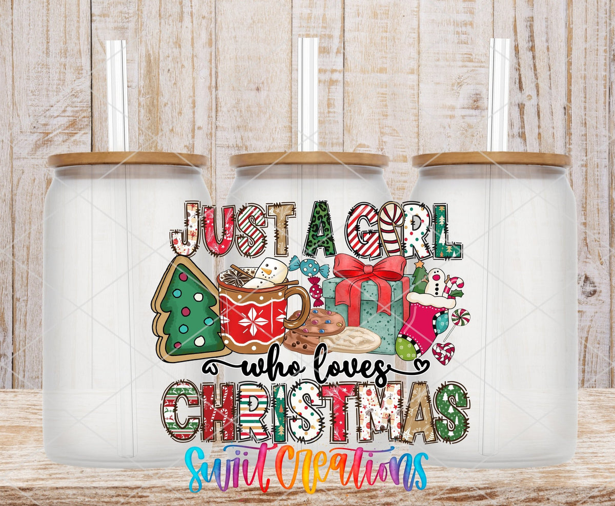 Just a Girl Who Loves Christmas UV DTF transfer applied to a clear glass can set from Swiit Creations