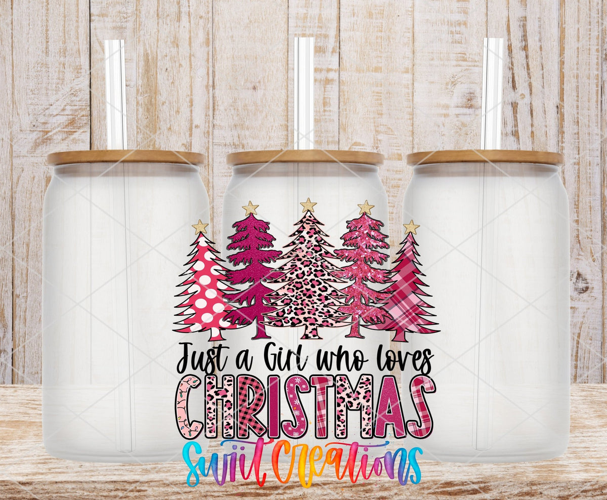 Just a Girl Who Loves Christmas UV DTF transfer applied to a clear glass can set from Swiit Creations