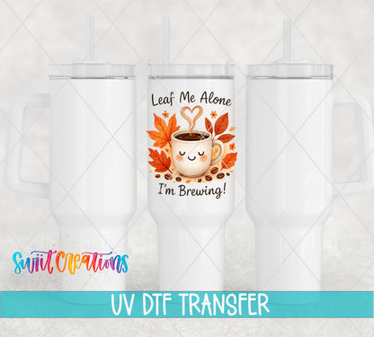 Leaf Me Alone Fall Coffee UV DTF transfer applied to a white tumbler set from Swiit Creations