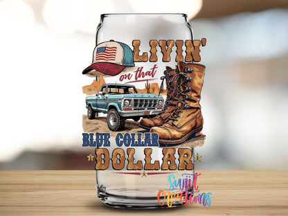 Livin On That Blue Collar Dollar UV DTF transfer applied to a clear glass can from Swiit Creations